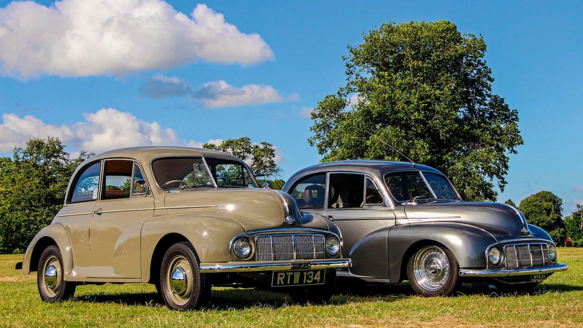 Classic Morris Minor next to a heavily modified example